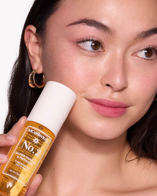 MCoBeauty Fragrance Mist No.2 sandalwood-caramel notes for a warm, inviting scent.