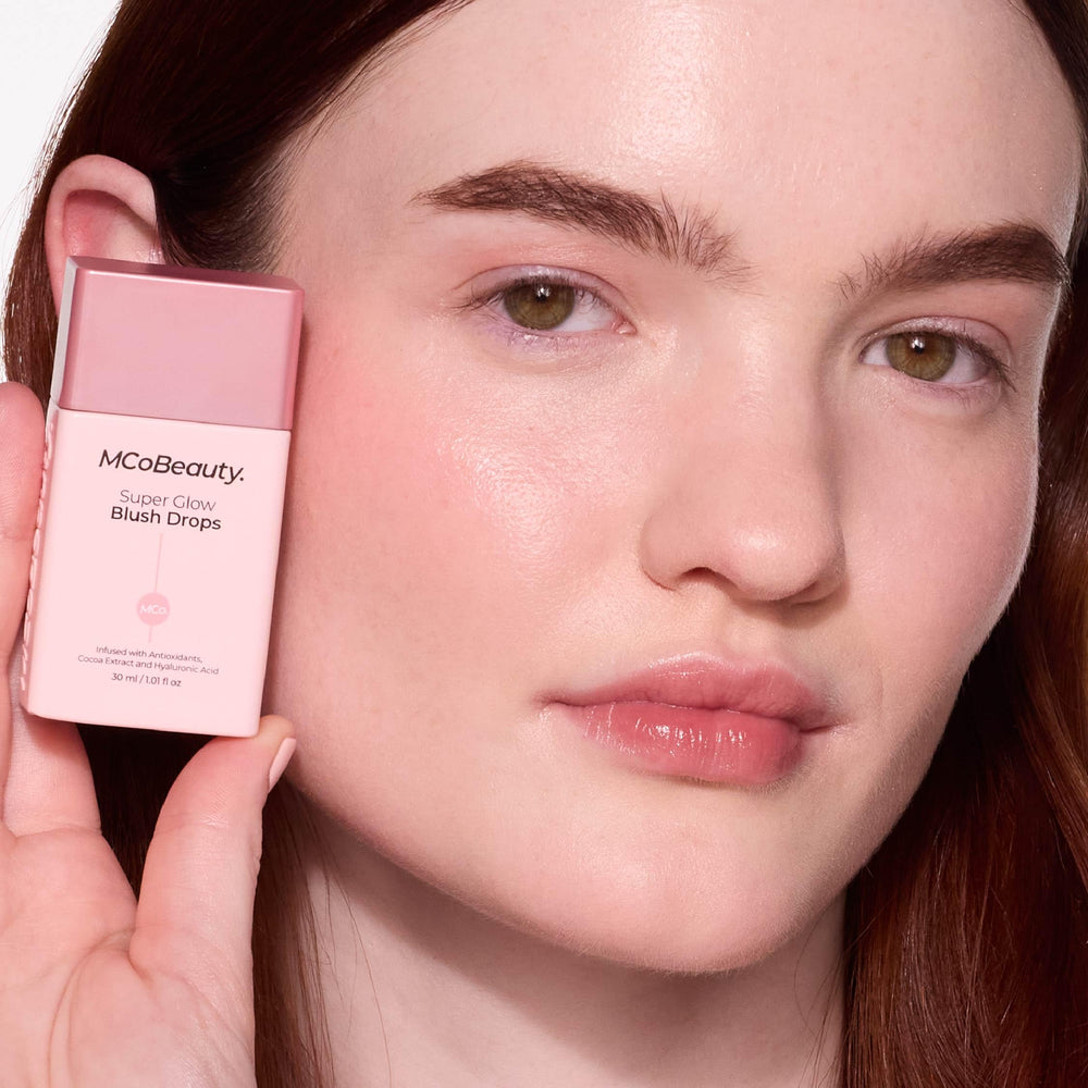 Product on cheek showing dewy rose pink glow.