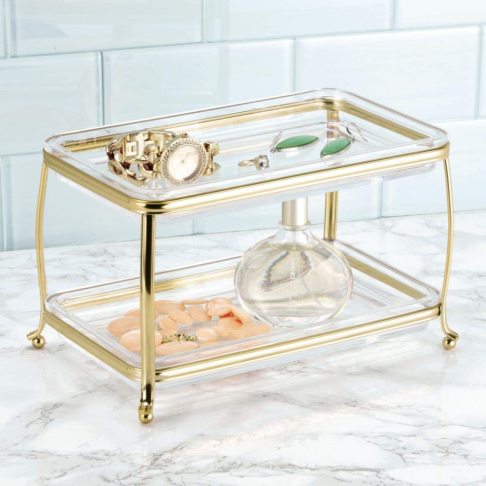 mDesign soft brass clear vanity tray with two-tier design ideal for small spaces.