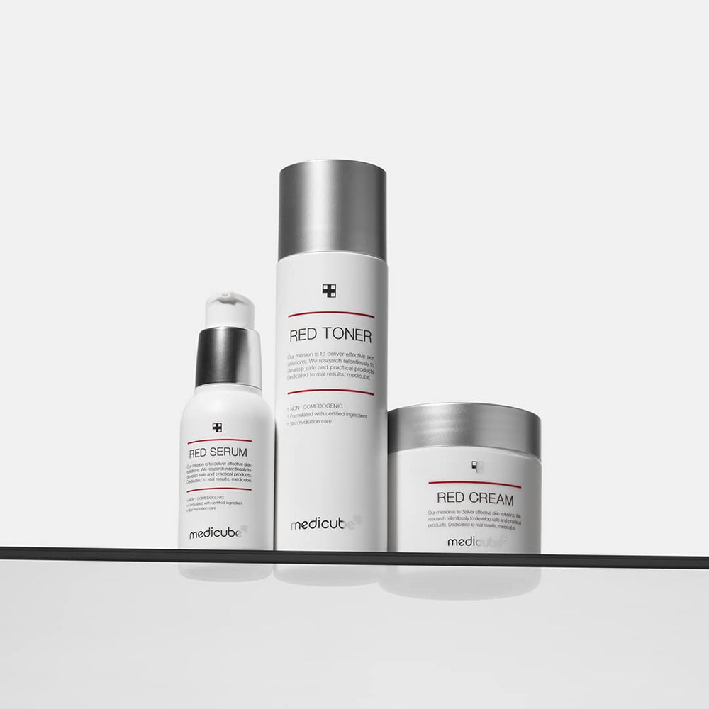 Medicube Red Toner 2.0 application swipe on skin.