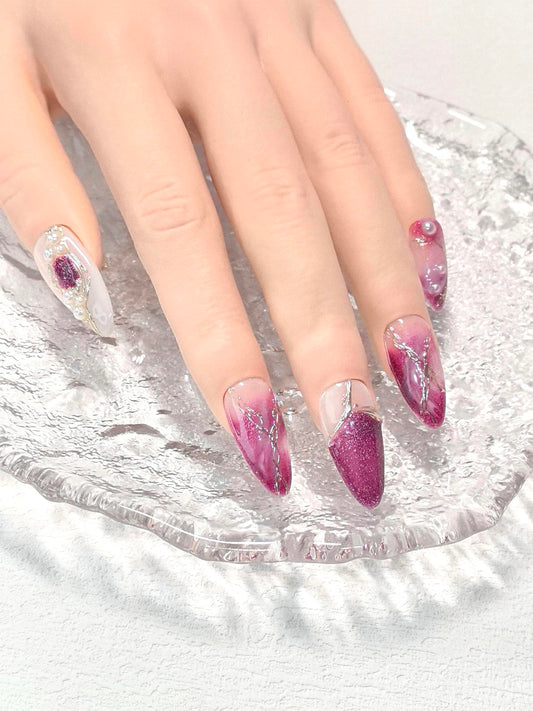 Medium almond press on nails with 3D pearl detailing for an elegant finish