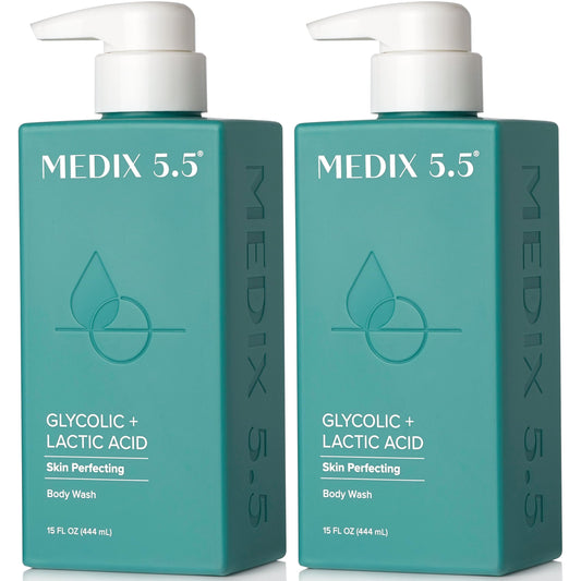 Medix 5.5 glycolic-lactic exfoliating body wash bottle in shower for gentle skin renewal.