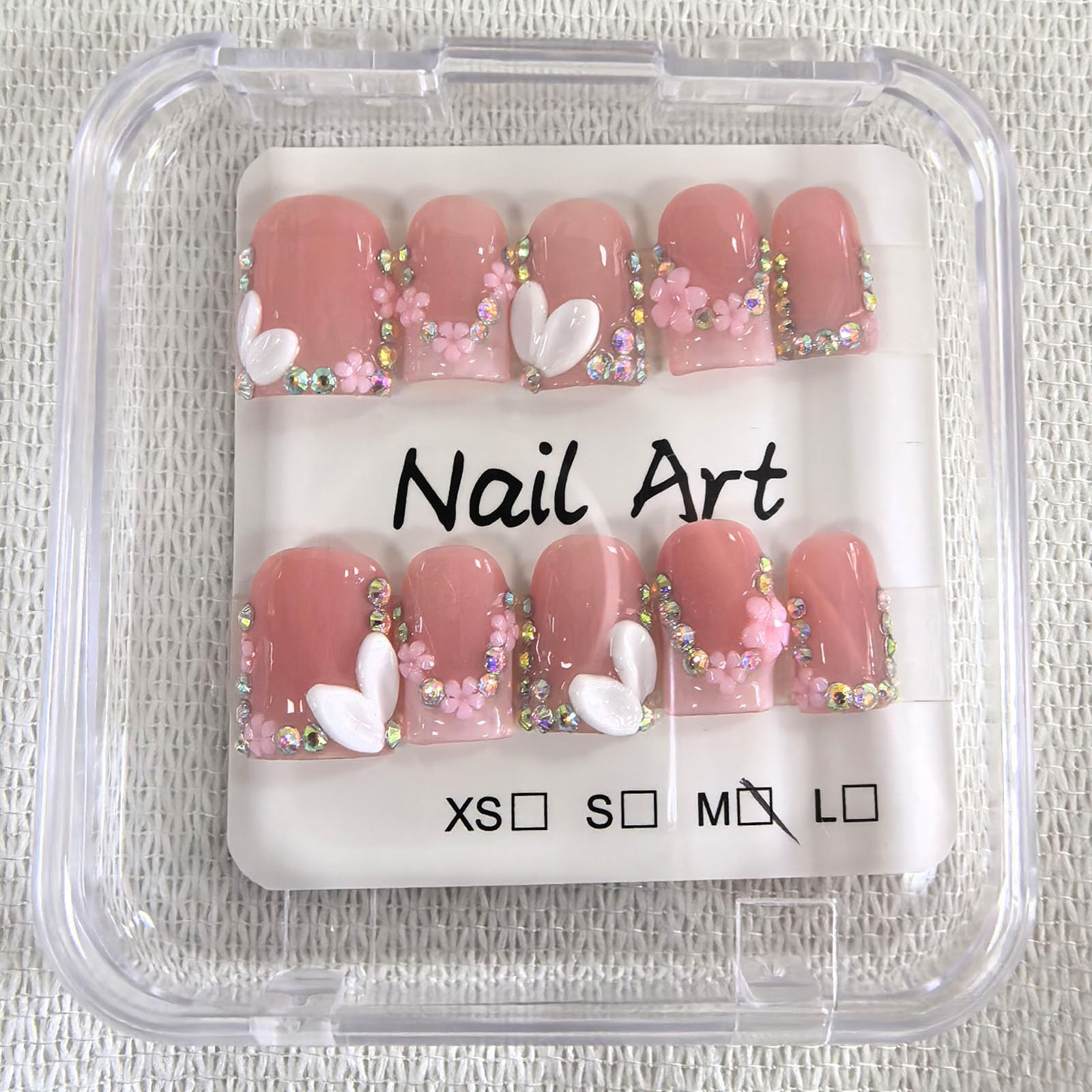 Meemooron 3D flower design with rhinestones on nails.