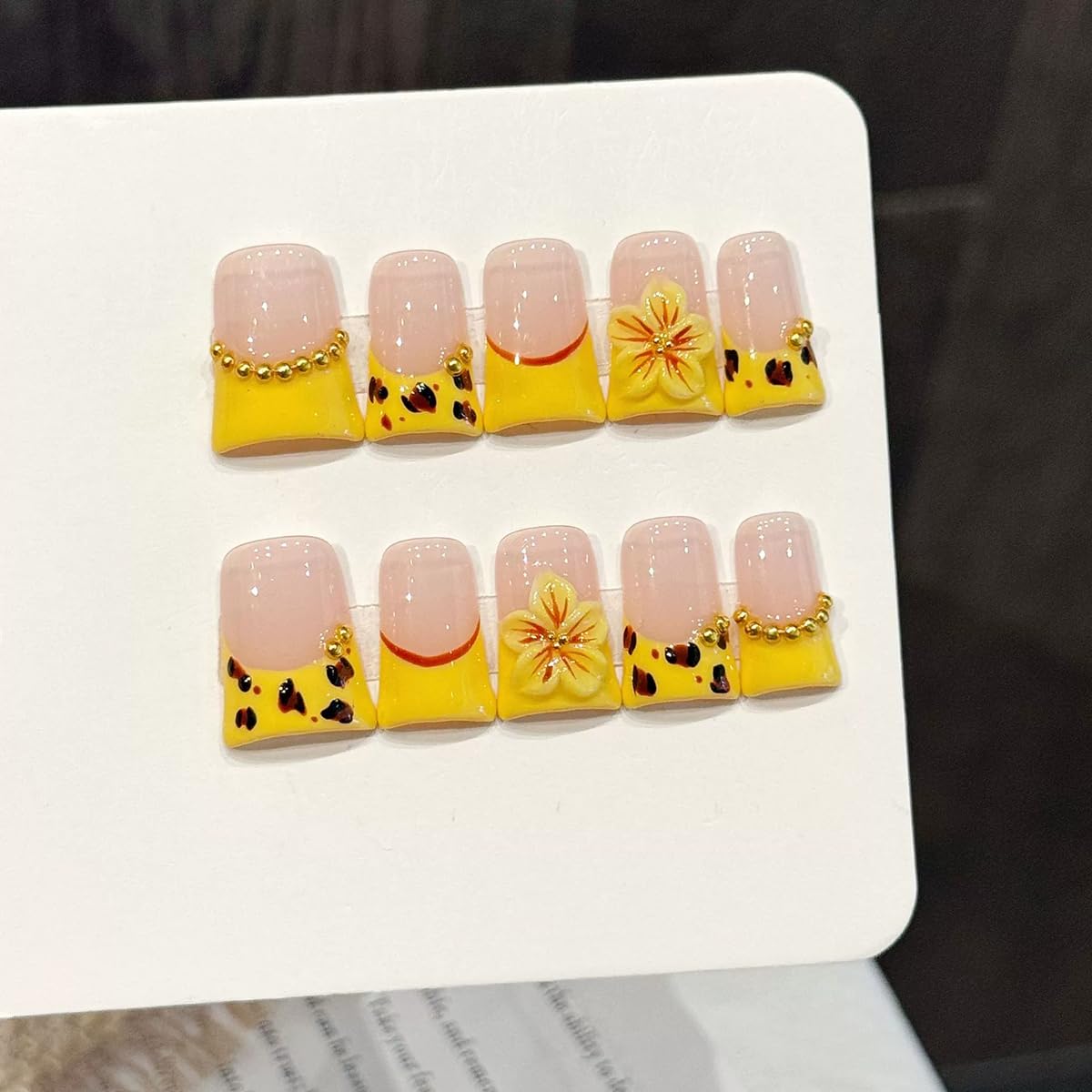 Meemooron Duck yellow French nails with 3D cherry blossoms for a chic look.