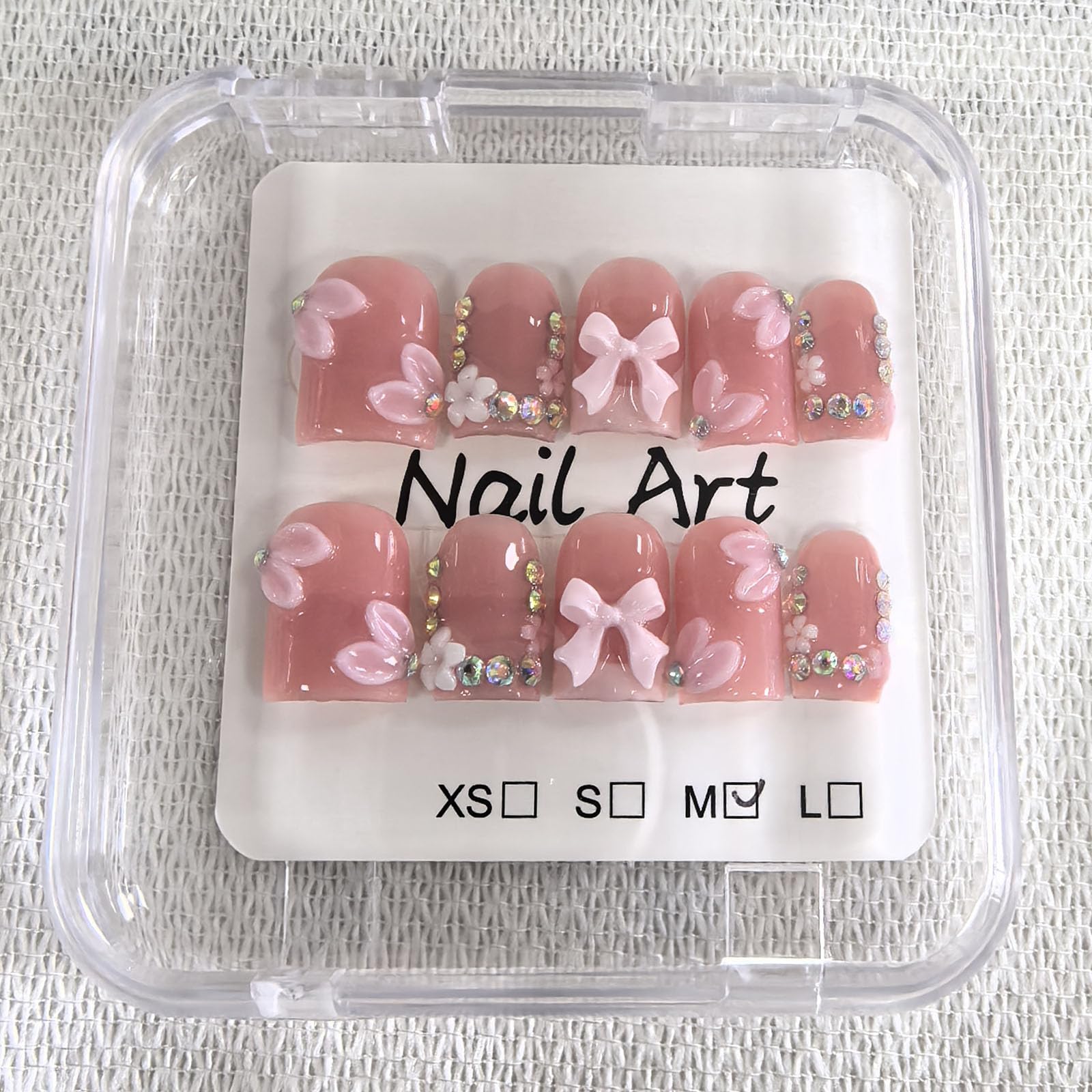 Meemooron glossy nails with luxury rhinestones boost at-home manicure.