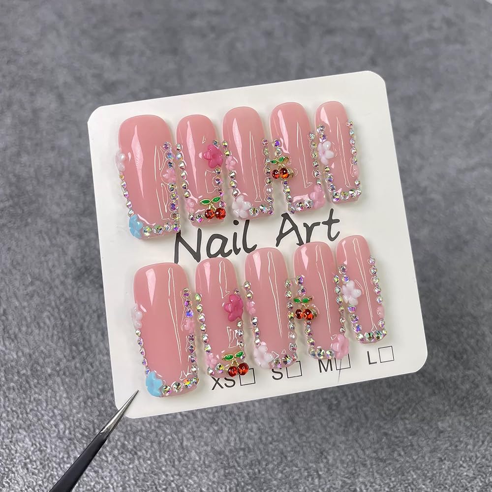 Meemooron nails with floral designs and pink sparkle finish for graceful vibes