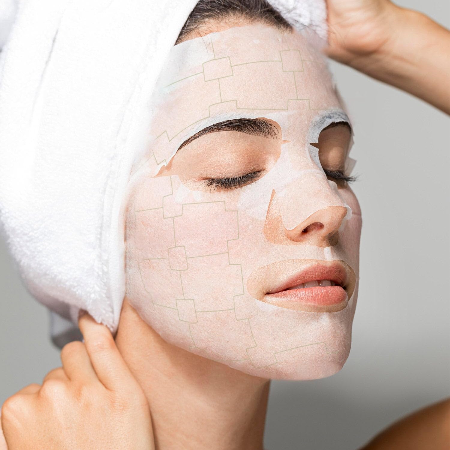MEGELIN botanical facial mask on face demonstrates comfortable, spa-like fit.