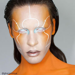 Mehron Liquid Makeup orange bottle ready for airbrush dilution.