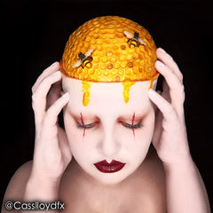 Mehron Paradise Makeup AQ yellow cream texture close-up highlighting rich pigment and smooth coverage.
