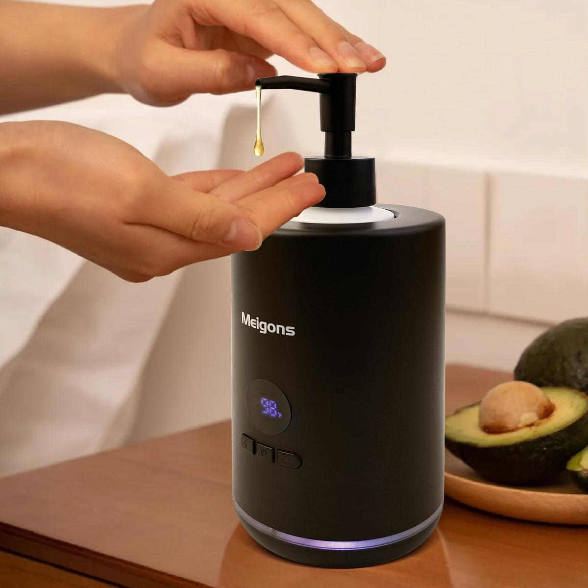Meigons oil warmer with black dispenser front view showing dual bottles ready for massage sessions.