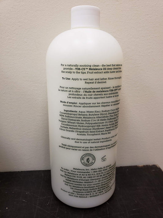 Melaleuca Original Shampoo 32oz bottle showing dry scalp massage for soothing hydration.