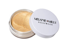 Melanie Mills Hollywood Gleam Radiant Dust on shoulders for a lustrous body highlight.