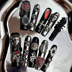 MellowBells black lace baroque nails closeup with rivet accents for bold styling.