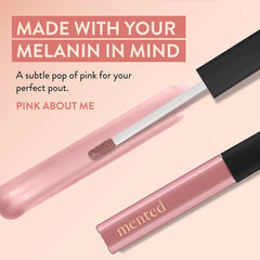 Mented Pink About Me lip gloss tube close-up with creamy texture.
