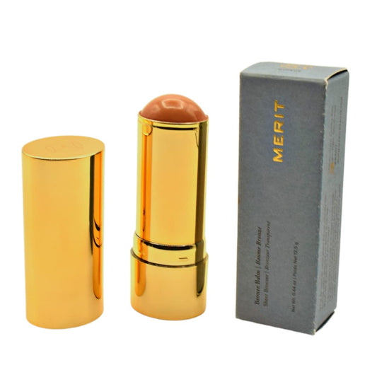 MERIT Bronze Balm Quince swatch on cheek demonstrates natural sun-kissed payoff.