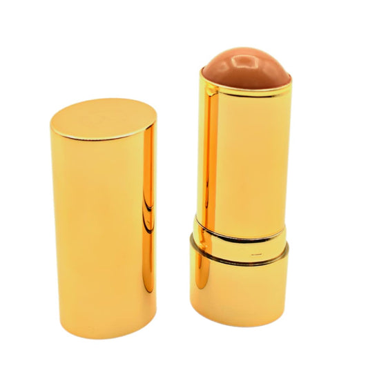 MERIT Bronze Balm Quince tube close-up showing a creamy, buildable bronze shade for easy glow.