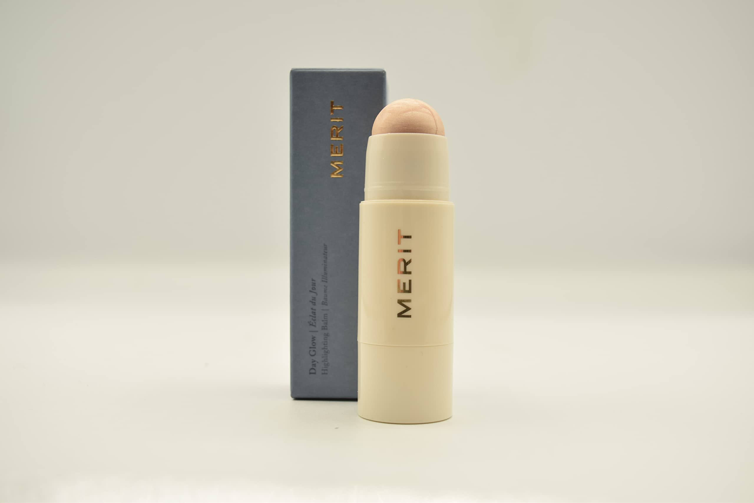 Merit Day Glow Dewy Highlighting Balm Cava packaging close-up highlighting vegan cruelty-free design
