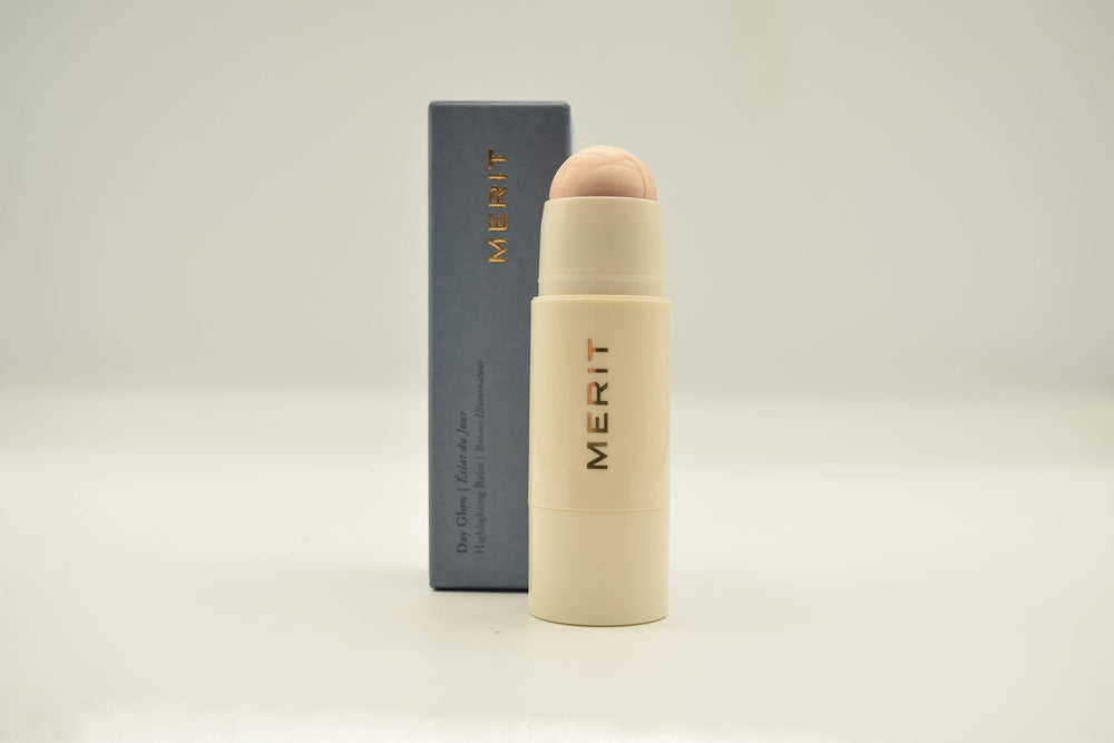 Merit Day Glow Dewy Highlighting Balm Cava packaging close-up highlighting vegan cruelty-free design