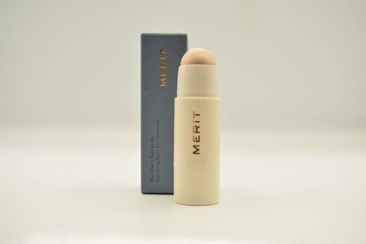 Merit Day Glow Dewy Highlighting Balm Cava packaging close-up highlighting vegan cruelty-free design