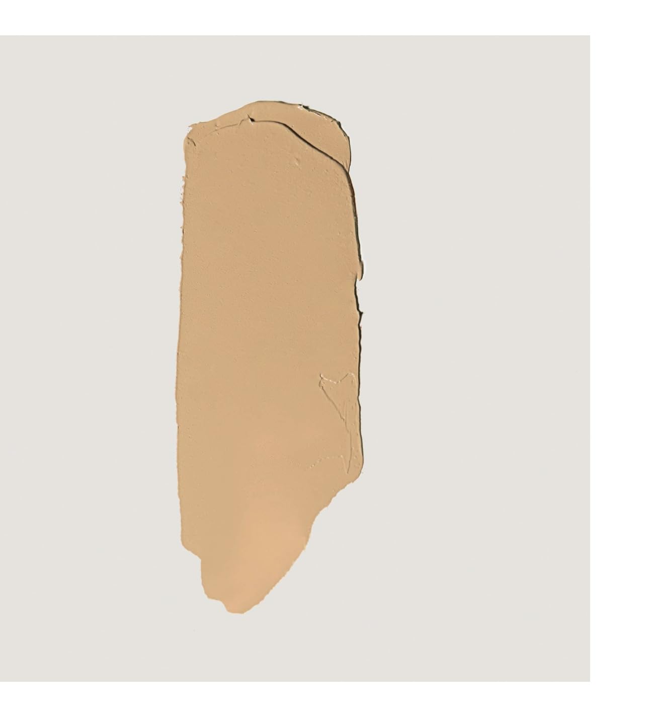 MERIT Camel shade stick applied for easy daily touch-ups and medium coverage.