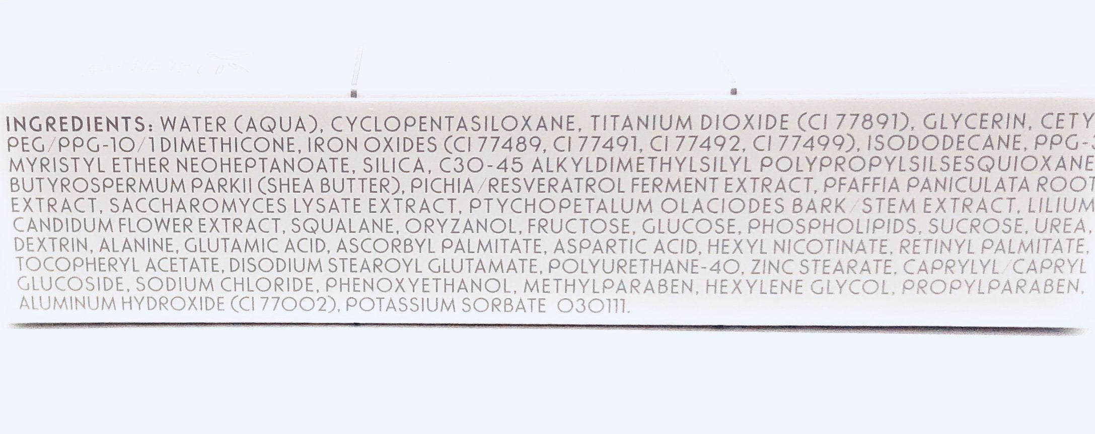Merle Norman Dual Action Concealer Light packaging close-up showing sleek design and portability