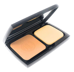 Merle Norman Ultra Powder Golden compact demonstrating oil absorption for a satin finish.