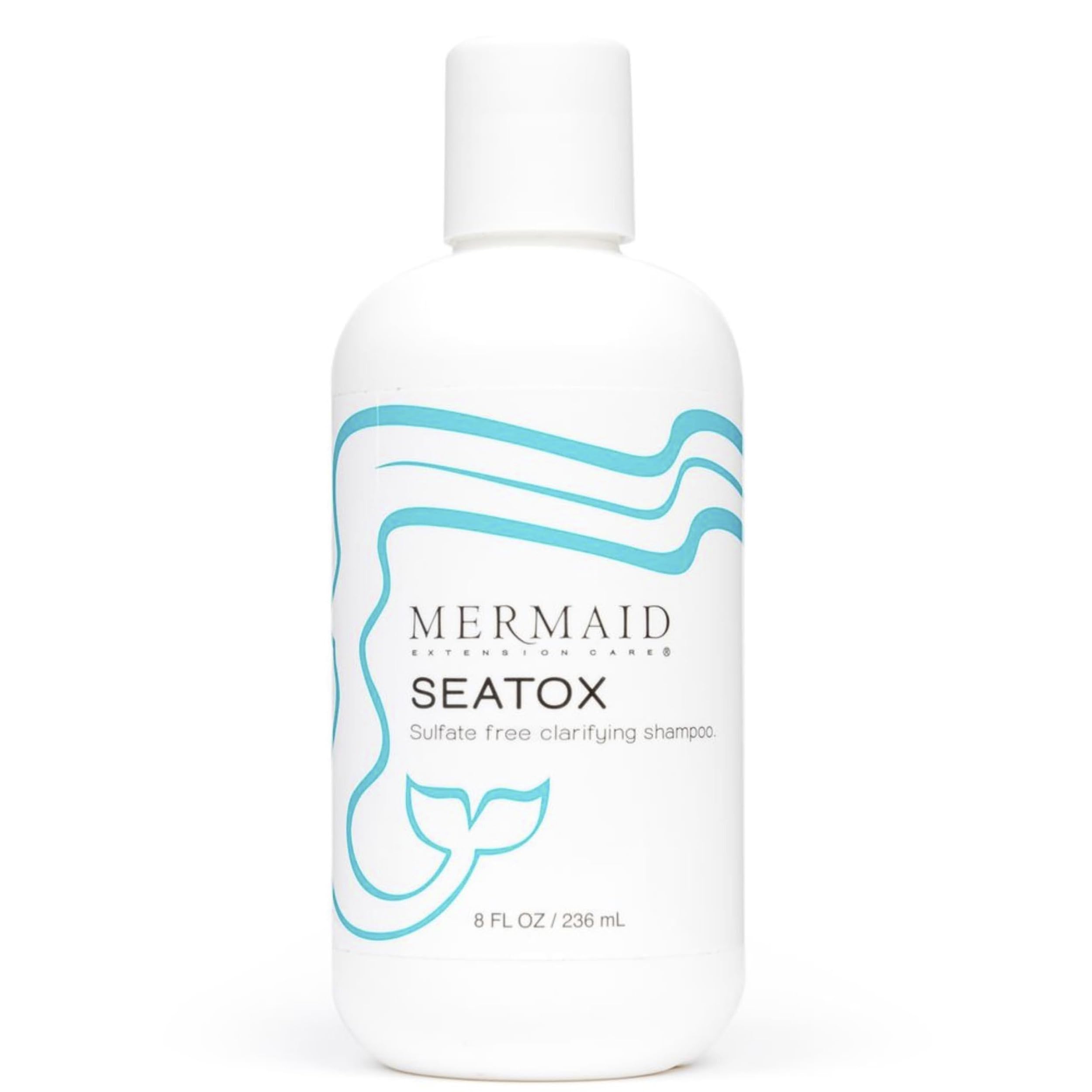 Mermaid Extension Care Seatox clarifying shampoo bottle pouring for deep cleansing on extensions.
