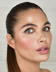 Cheek application swatch showing translucent tint for natural flush.