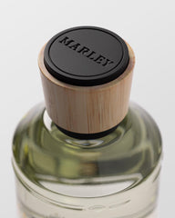 Michael Malul Marley Place of Peace bottle angled shot, emphasizes elegant fragrance presence.