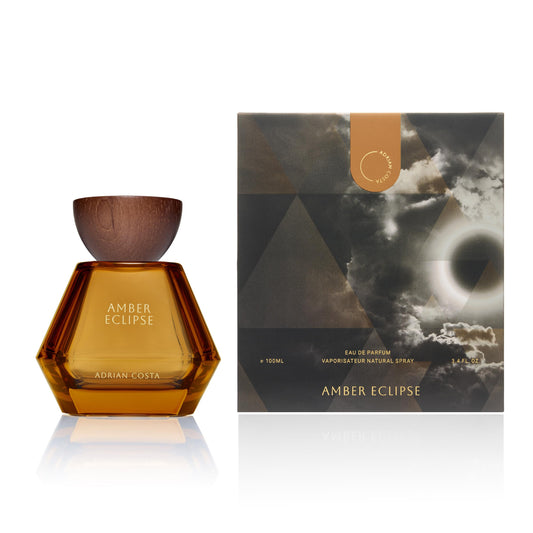 Michael Malul Adrian Costa Amber Eclipse bottle closeup highlighting textured glass and amber tone for gifting.