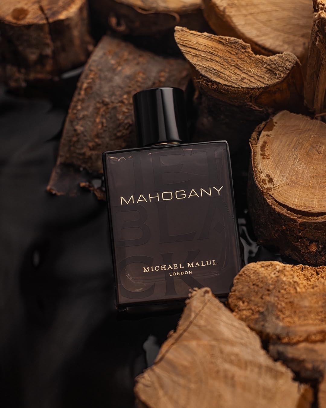 Michael Malul Jet Black Mahogany close-up label highlights premium packaging.