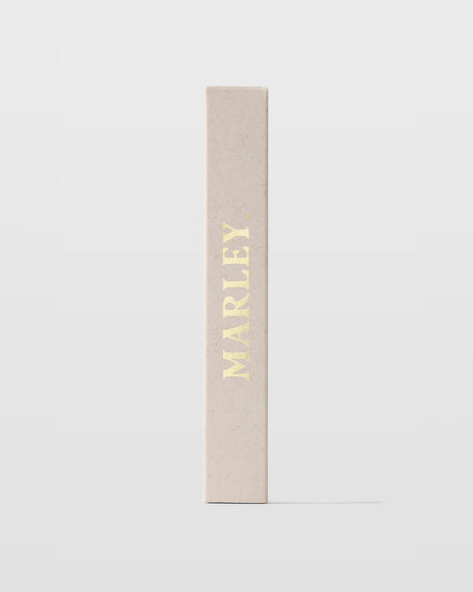 Michael Malul Marley Soul Rebel fragrance application highlighting energetic mango and grapefruit blend