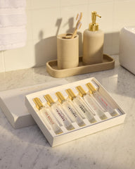 Michael Malul travel-friendly 10ml bottles shown in a sleek case.
