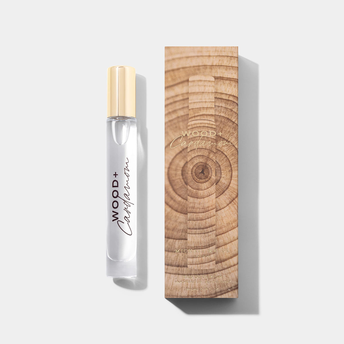Michael Malul Wood + Cardamom travel bottle for on-the-go fragrance.