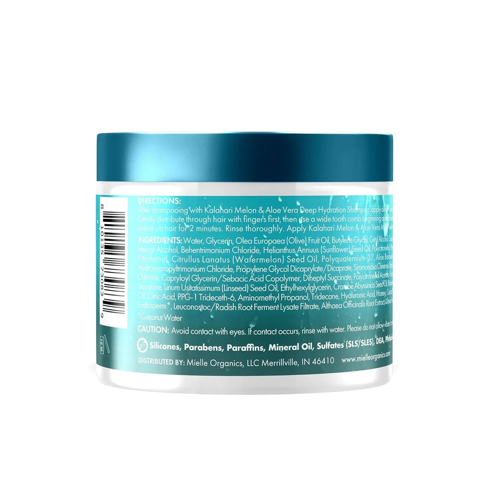 Mielle Organics conditioner bottle on a clean bathroom shelf.