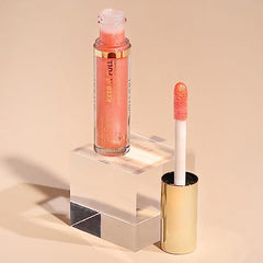 Lips after gloss showing soft rose color and subtle sheen.