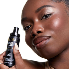 Milani setting spray application shot shows even mist for seamless wear.