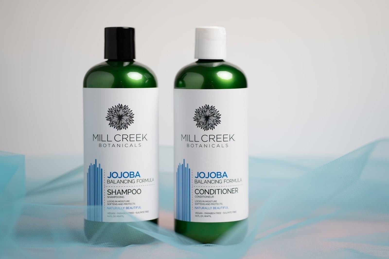 Mill Creek Botanicals Jojoba Conditioner bottle nourishes without weighing hair down.