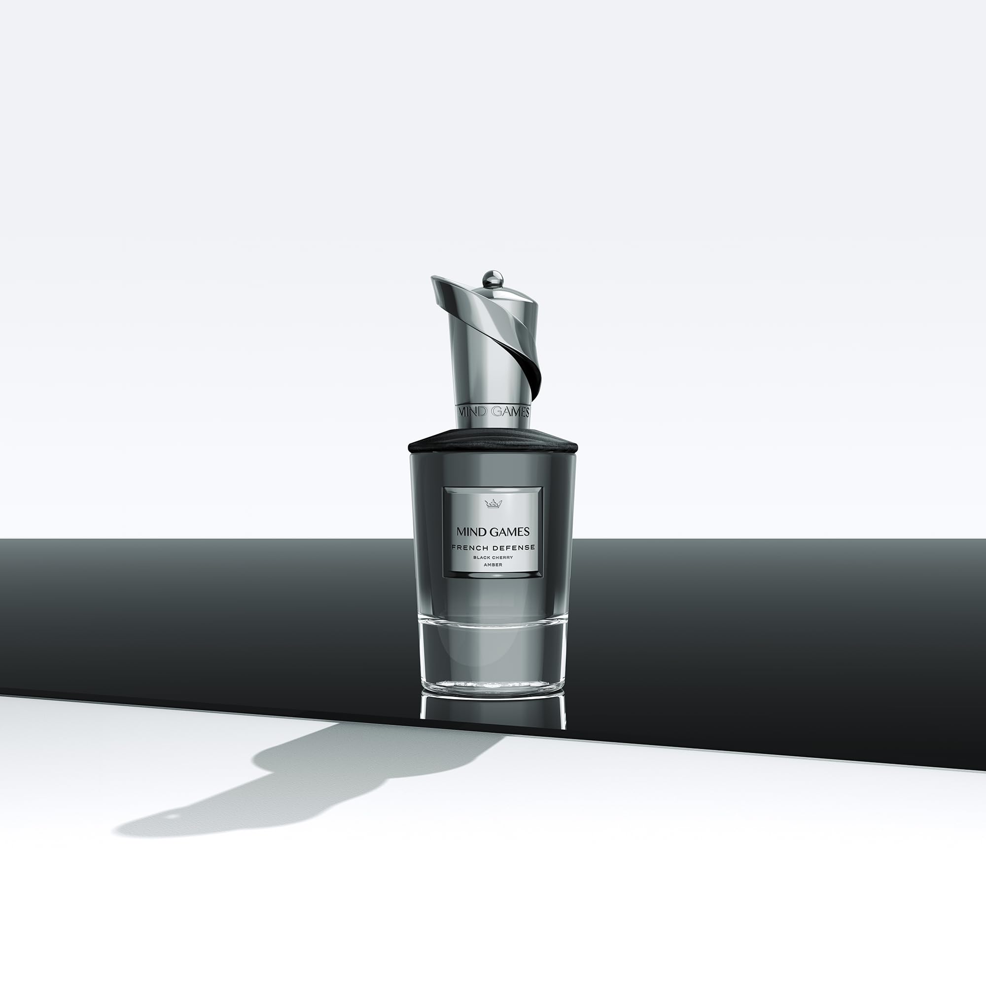 Elegant packaging display of MIND GAMES French Defense Extrait de Parfum.