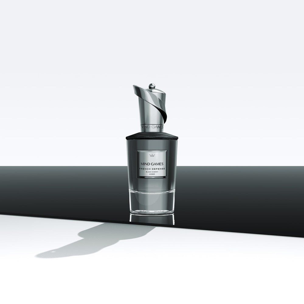 Elegant packaging display of MIND GAMES French Defense Extrait de Parfum.