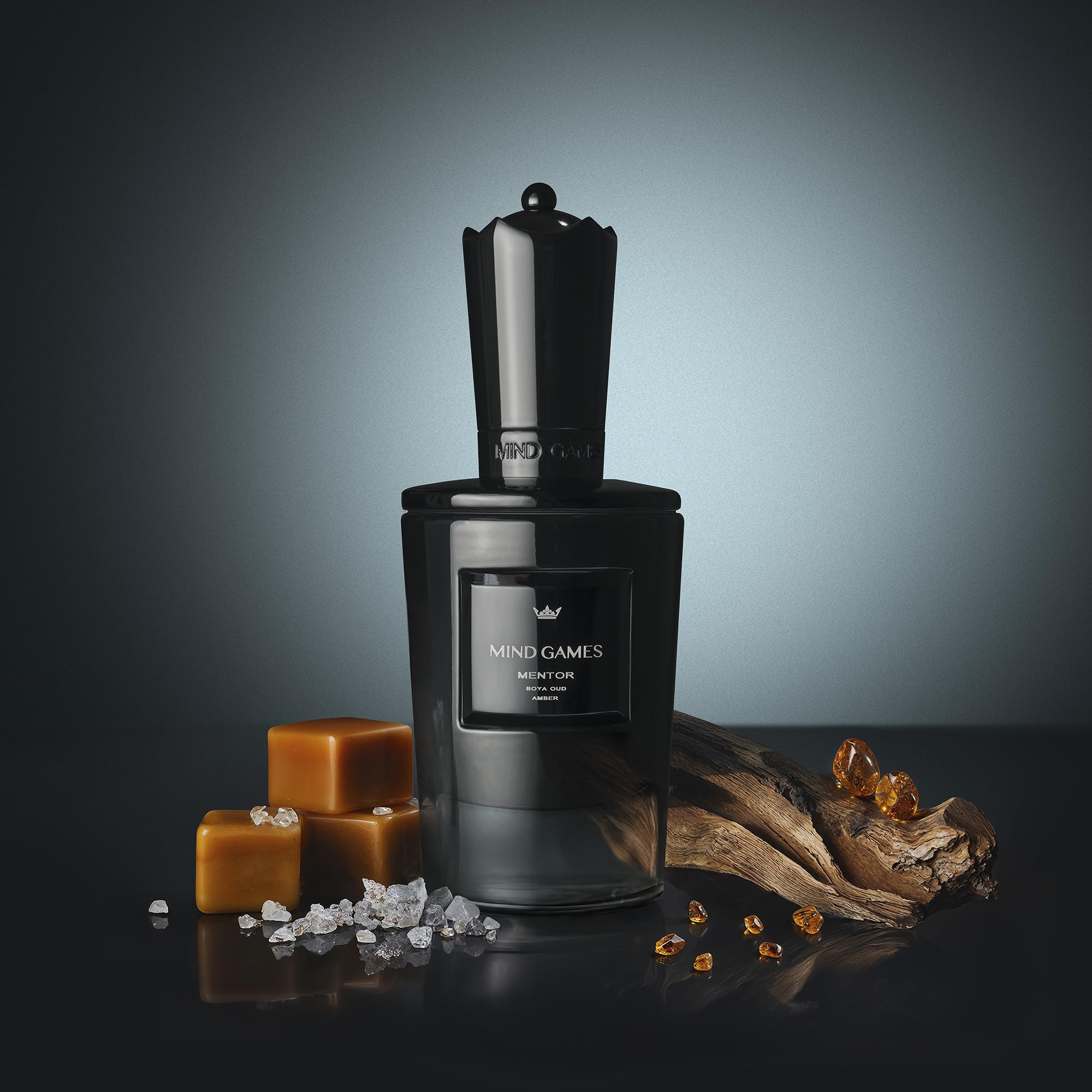 MIND GAMES Mentor middle notes image spotlights amber coffee and cassis for a confident aura