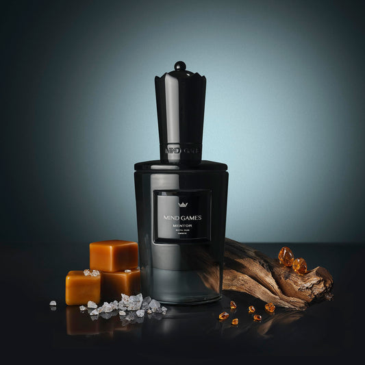 MIND GAMES Mentor middle notes image spotlights amber coffee and cassis for a confident aura