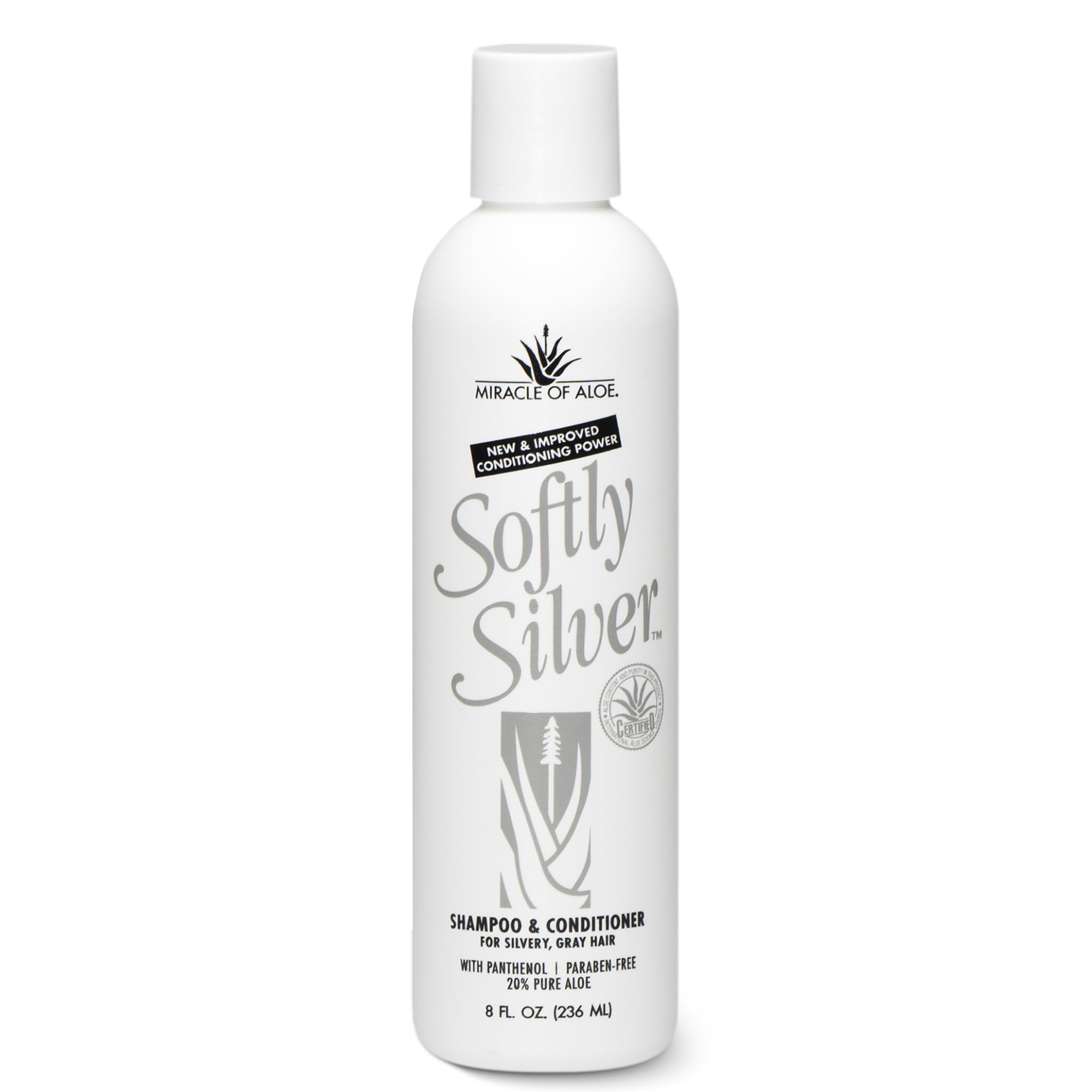 Miracle of Aloe Softly Silver Shampoo on a vanity with shiny, healthy-looking hair.