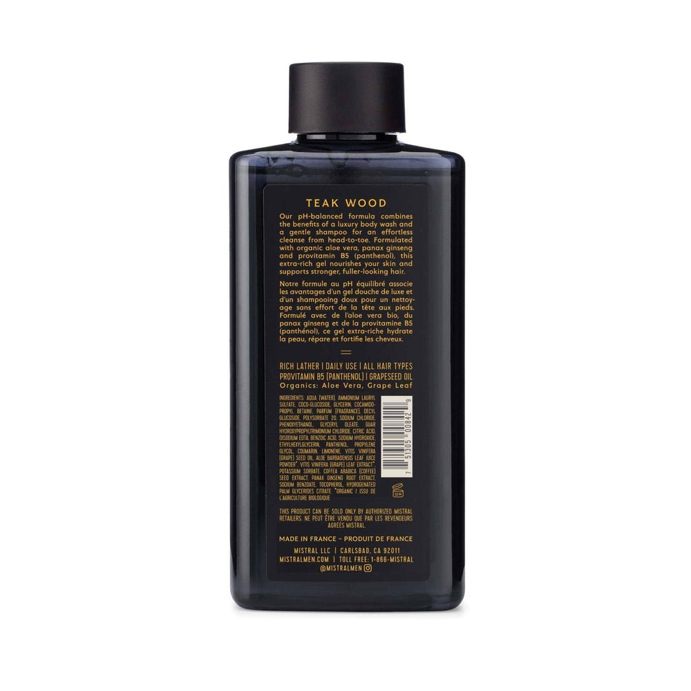 Mistral Teakwood bottle pouring rich lather for shower.