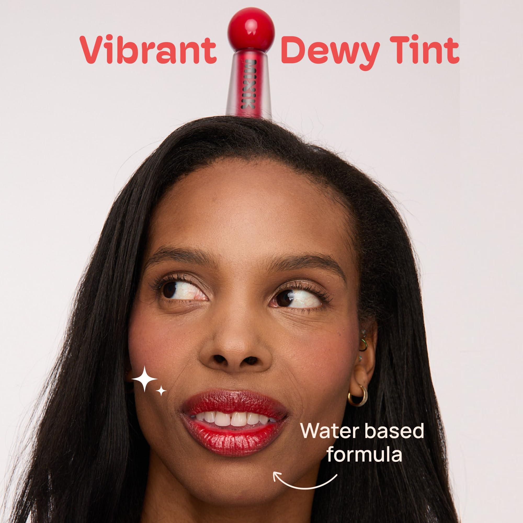 Mixik Juicy Lip Tint swatches on skin reveal vibrant color and even staining.