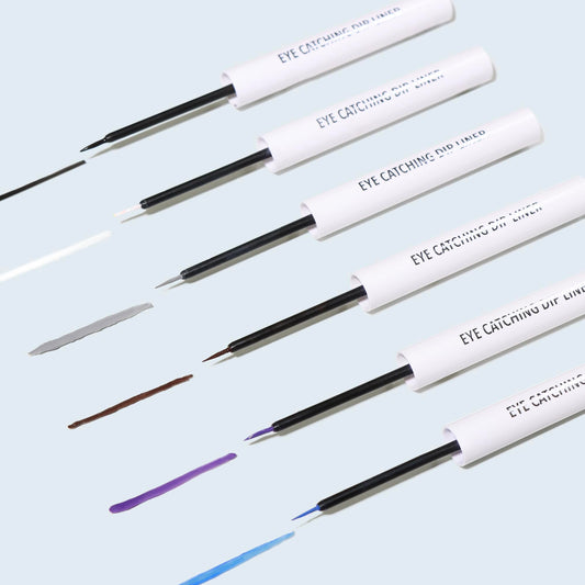 Moira Dip Liner brush tip close-up applying royal blue line for smudge-resistant wear
