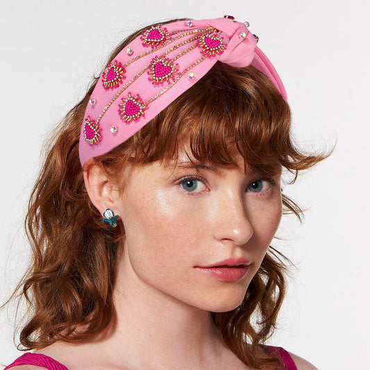 MOLOCH crystal-knotted design highlights a chic, festive look for parties.