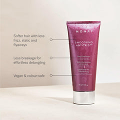 MONAT applying conditioner to mid-lengths and ends for moisture distribution.