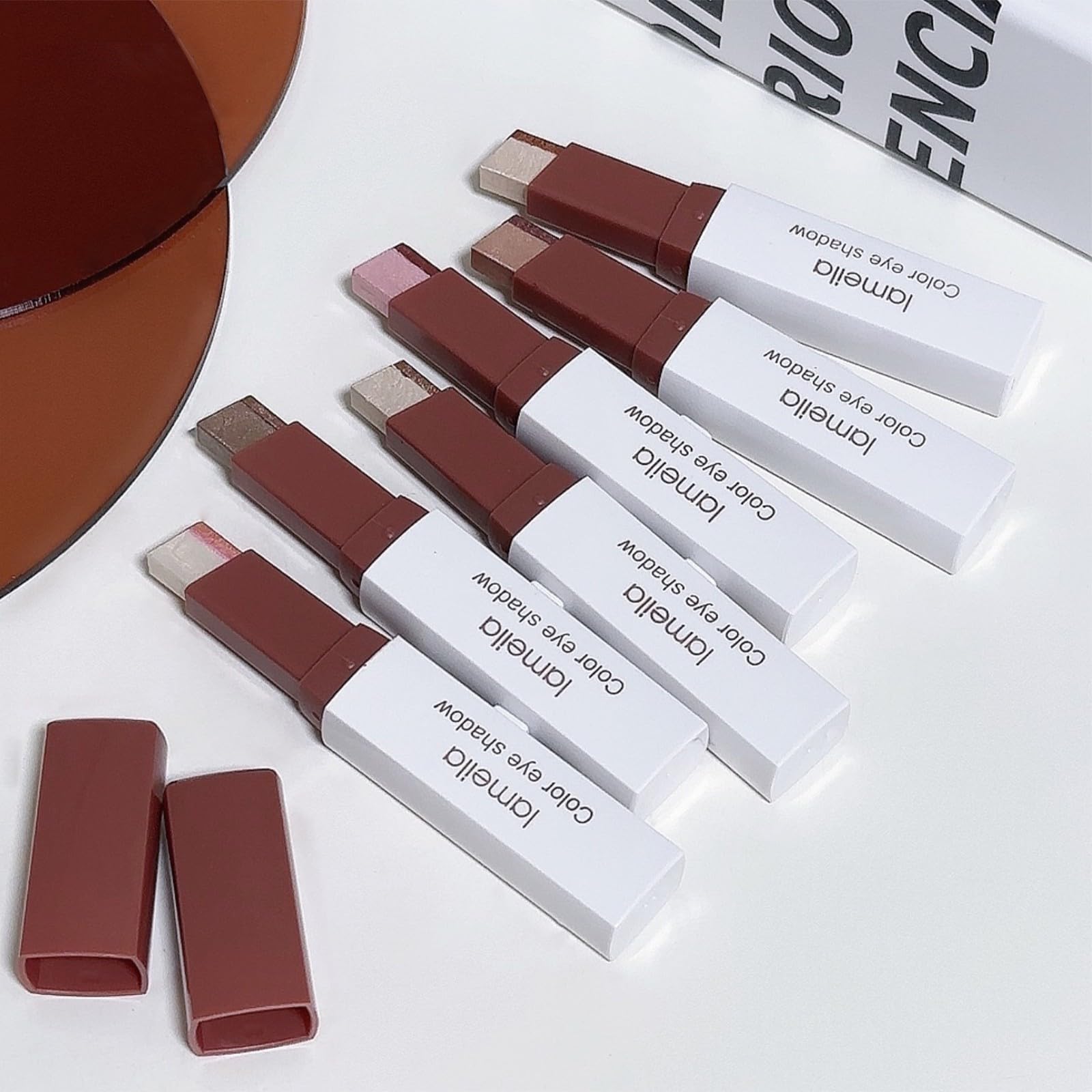 MooGlamor retractable eyeshadow stick with a slider design for precise, portable application.