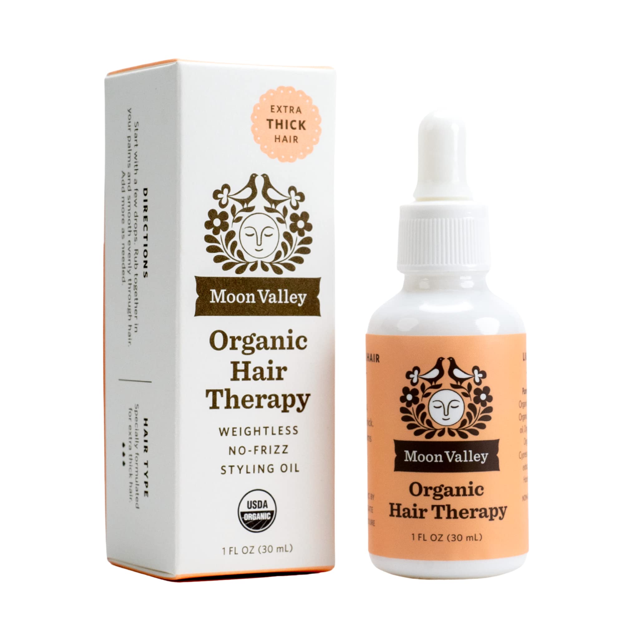 Moon Valley Organics Hair Therapy bottle close-up highlighting hydrating oils